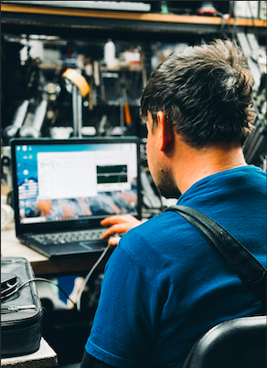 Technician organizing AV rack cables